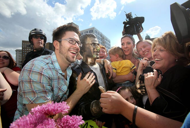 American Idol finalist Danny Gokey checks out the Bronze Fonz on the Riverwalk in downtown Milwaukee, May 8, 2009. Gokey, a Milwaukee native, was a third-place finalist.